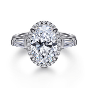 Gabriel & Co. ER16222O12W44JJ 14 karat white gold Contemporary engagement ring, front view of an oval center with a halo of small round stones between two tapered baguettes