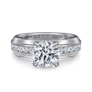 Gabriel & Co. ER16232R6W44JJ 14 karat white gold Contemporary engagement ring, front view of a round center flanked by channel set diamonds edged in milgrain