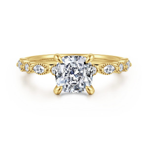 Gabriel & Co. ER16233C6Y44JJ 14 karat yellow gold Victorian engagement ring, front view of a cushion cut center flanked by round and elongated diamonds in beaded frames