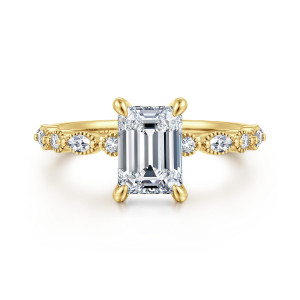 Gabriel & Co. ER16233E6Y44JJ 14 karat yellow gold Victorian engagement ring, front view of an emerald cut center flanked by round and elongated diamonds in beaded rims
