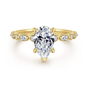 Gabriel & Co. ER16233P6Y44JJ 14 karat yellow gold Victorian engagement ring, front view of a pear shaped center with a pointed tip prong between beaded round stones