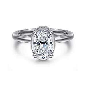 Gabriel & Co. ER16238O6W44JJ 14 karat white gold Classic engagement ring, front view of an oval center in four rounded prongs inside a beaded oval rim