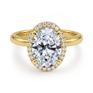 Gabriel & Co. ER16241O12Y44JJ 14 karat yellow gold Classic engagement ring, front view of an oval center inside a single halo of round diamonds and a beaded band edge