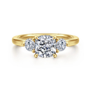 Gabriel & Co. ER16252C6Y44JJ 14 karat yellow gold Classic engagement ring, front view of a cushion center flanked by round side stones, with a milgrain edge behind
