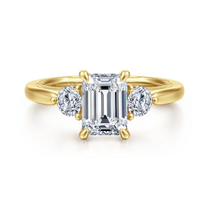 Gabriel & Co. ER16252E6Y44JJ 14 karat yellow gold Classic engagement ring, front view of an emerald cut center flanked by round side stones and four claw prongs
