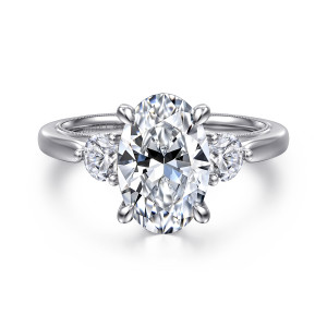 Gabriel & Co. ER16252O10W44JJ 14 karat white gold Classic engagement ring, front view of an oval center in four claws with a round stone on each side