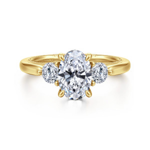 Gabriel & Co. ER16252O6Y44JJ 14 karat yellow gold Classic engagement ring, front view of an oval center between round side stones, each in its own small prongs
