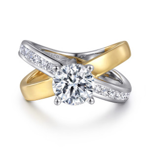 Gabriel & Co. ER16259R6M44JJ 14 karat white and yellow gold Contemporary engagement ring, front view of the straps crossing in an X beneath the round center with four prongs