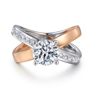 Gabriel & Co. ER16259R6T44JJ 14 karat white and rose gold Contemporary engagement ring, front view of the crossing bands with a channel of diamonds running toward the round center