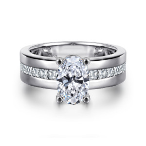 Gabriel & Co. ER16260O6W44JJ 14 karat white gold Contemporary engagement ring, front view of an oval center on ball tipped prongs above a channel of square diamonds