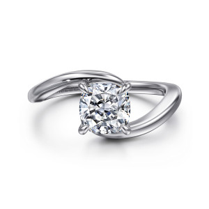 Gabriel & Co. ER16277C6W4JJJ 14 karat white gold Contemporary engagement ring, front view of a cushion cut center with the band ends sweeping past each other beneath it