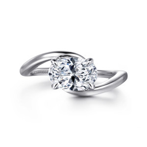 Gabriel & Co. ER16277O6W4JJJ 14 karat white gold Contemporary engagement ring, front view of an oval center lying sideways between two smooth crossing arms