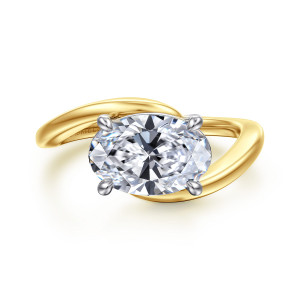 Gabriel & Co. ER16277O8M4JJJ 14 karat white and yellow gold Contemporary engagement ring, front view of an oval center set crosswise between two band ends that sweep past each other