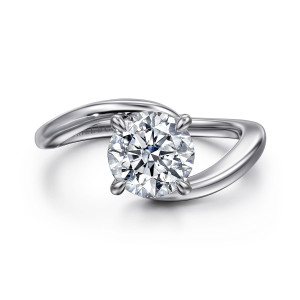 Gabriel & Co. ER16277R6W4JJJ 14 karat white gold Contemporary engagement ring, front view of a round center between two band ends that sweep past each other