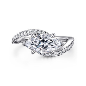 Gabriel & Co. ER16278M6W44JJ 14 karat white gold Contemporary engagement ring, front view of a sideways marquise center between sweeping arms lined with small diamonds
