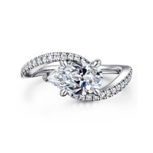 Gabriel & Co. ER16278P6W44JJ 14 karat white gold Contemporary engagement ring, front view of a sideways pear shaped center between the crossing ends of a diamond set band