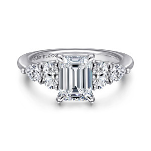 Gabriel & Co. ER16279E6W44JJ 14 karat white gold Contemporary engagement ring, front view of an emerald cut center between oval and pear shaped side stones on a smooth band