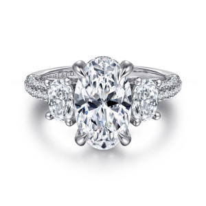 Gabriel & Co. ER16284O12W44JJ 14 karat white gold Classic engagement ring, front view of a tall oval center with four pointed prongs between oval side stones