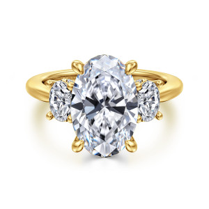 Gabriel & Co. ER16285O16Y44JJ 14 karat yellow gold Classic engagement ring, front view of a large oval center in four claws with an oval stone at each side