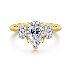 Gabriel & Co. ER16285P6Y44JJ 14 karat yellow gold Classic engagement ring, front view of a pear shaped center with a pointed tip prong between two oval side stones