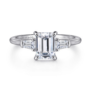 Gabriel & Co. ER16288E6W44JJ 14 karat white gold Classic engagement ring, front view of the emerald cut center between tapered baguette diamonds with metal end caps