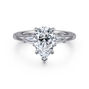 Gabriel & Co. ER16289P6W43JJ 14 karat white gold Classic engagement ring, front view of a pear shaped center with a V shaped tip and tapered baguette side stones