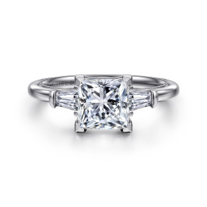 Gabriel & Co. ER16289S6W43JJ 14 karat white gold Classic engagement ring, front view of a princess cut center in corner prongs between two tapered baguette side stones
