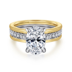 Gabriel & Co. ER16303O8M44JJ 14 karat white and yellow gold Contemporary engagement ring, front view of an oval center in four claw prongs with a diamond strip between raised rims