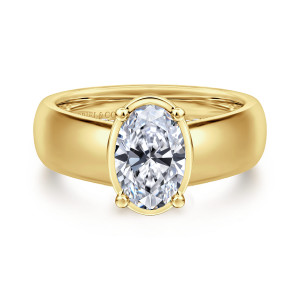 Gabriel & Co. ER16304O6Y44JJ 14 karat yellow gold Contemporary engagement ring, front view of an oval center in a thin collar with ball tipped prongs on a broad band