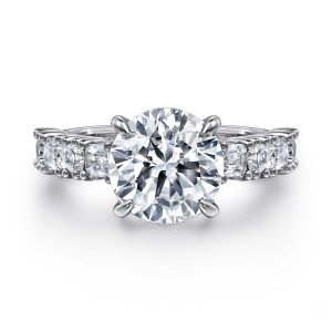 Gabriel & Co. ER16305R12W44JJ 14 karat white gold Contemporary engagement ring, front view of a round center flanked by step cut stones set in small prongs