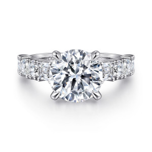 Gabriel & Co. ER16306R12W44JJ 14 karat white gold Contemporary engagement ring, front view of a round center on four claw prongs flanked by wide shoulder stones