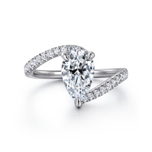 Gabriel & Co. ER16320P6W44JJ 14 karat white gold Contemporary engagement ring, front view of a pear shaped center with diamond set band ends sweeping past above and below it