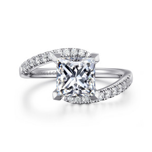Gabriel & Co. ER16320S6W44JJ 14 karat white gold Contemporary engagement ring, front view of diamond set arms passing on either side of a princess cut center