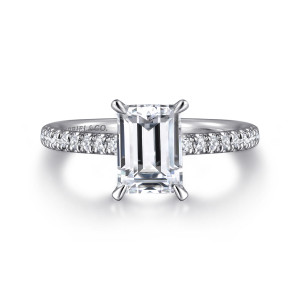 Gabriel & Co. ER16321E6W44JJ 14 karat white gold Classic engagement ring, front view of the emerald cut center held at its corners with diamonds along the band