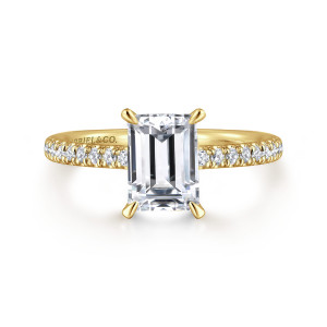 Gabriel & Co. ER16321E6Y44JJ 14 karat yellow gold Classic engagement ring, front view of an emerald cut center between four claw prongs and diamonds on each shoulder