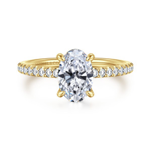 Gabriel & Co. ER16321O6Y44JJ 14 karat yellow gold Classic engagement ring, front view of an oval center with four claws and fine round diamonds on each shoulder