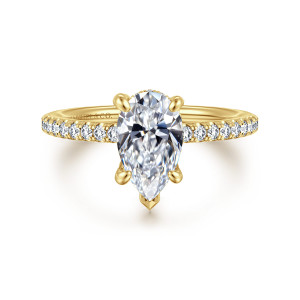 Gabriel & Co. ER16321P6Y44JJ 14 karat yellow gold Classic engagement ring, front view of a pear shaped center with a pointed metal cap at its narrow end