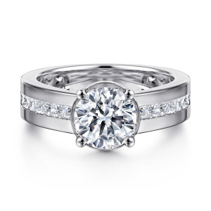 Gabriel & Co. ER16328R6W44JJ 14 karat white gold Contemporary engagement ring, front view of a round center in a round collar with four rounded prongs above the channel band