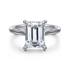 Gabriel & Co. ER16336E12W4JJJ 14 karat white gold Contemporary engagement ring, front view of the emerald cut center in four rounded claw prongs on a smooth band
