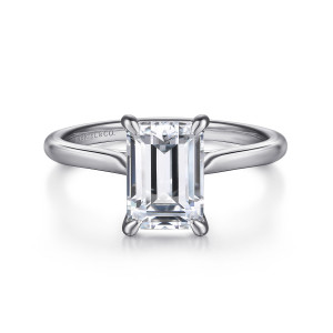 Gabriel & Co. ER16336E8W4JJJ 14 karat white gold Contemporary engagement ring, front view of the long emerald cut center held at its corners by four teardrop shaped prongs