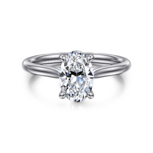 Gabriel & Co. ER16336O6W4JJJ 14 karat white gold Contemporary engagement ring, front view of an oval center in four rounded prongs, the plain band tapering up to the head