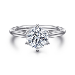 Gabriel & Co. ER16336R6W4JJJ 14 karat white gold Contemporary engagement ring, front view of a round center held by evenly spaced teardrop tipped prongs above a smooth band