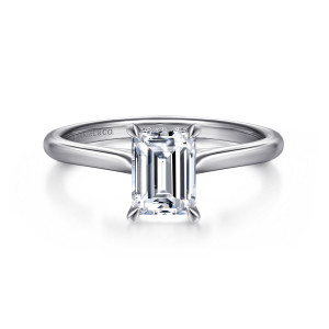 Gabriel & Co. ER16337E4W44JJ 14 karat white gold Contemporary engagement ring, front view of an emerald cut center in four claw prongs with a slim tapered band