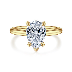 Gabriel & Co. ER16337P8Y44JJ 14 karat yellow gold Contemporary engagement ring, front view of the pear shaped center with a V shaped tip at its point and rounded claws