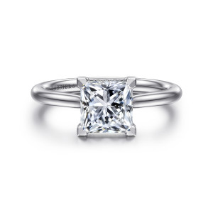 Gabriel & Co. ER16337S6W44JJ 14 karat white gold Contemporary engagement ring, front view of the square center gripped at the corners by square edged prongs on a rounded band
