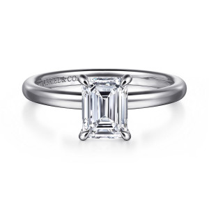Gabriel & Co. ER16338E6W4JJJ 14 karat white gold Contemporary engagement ring, front view of an emerald cut center held by four claw prongs on a smooth plain band