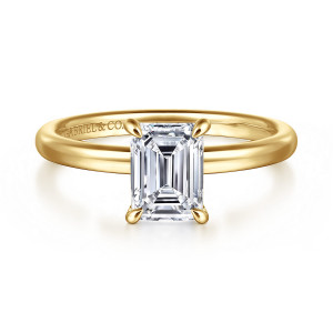 Gabriel & Co. ER16338E6Y4JJJ 14 karat yellow gold Contemporary engagement ring, front view of an emerald cut center in claws with teardrop tips above a smooth rounded band