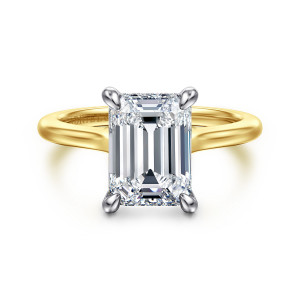 Gabriel & Co. ER16339E12M44JJ 14 karat white and yellow gold Classic engagement ring, front view of an emerald cut center in lighter prongs above a warmer band