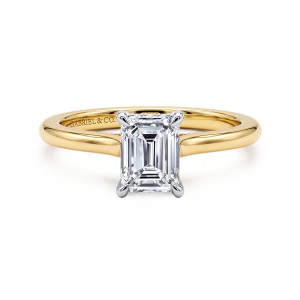 Gabriel & Co. ER16339E4M44JJ 14 karat white and yellow gold Classic engagement ring, front view of an emerald cut center on four slim prongs with shoulders curving up to the head