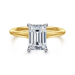 Gabriel & Co. ER16339E8M44JJ 14 karat white and yellow gold Classic engagement ring, front view of an emerald cut center in four claws above a smooth band widening at the head